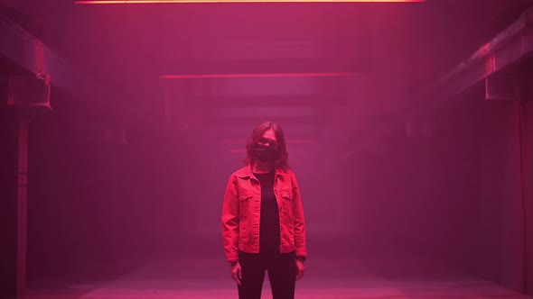 Woman Wearing Face Mask in a Dark Corridor Standing and Creepy Moving Her Head