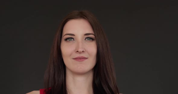 Beautiful Girl with Long Hair Standing Straight and Smiling alt