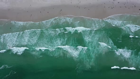 Top View of Calm Ocean Waves Crashing on Sandy Beach
