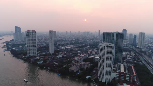 4k Aerial city view of Bangkok dowtnown, Flying over Bangkok, Thailand. alt