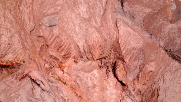 4K Aerial view of rock fissures eroded by water. alt
