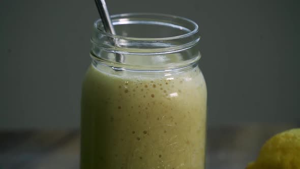 Rotating shot of Aloe Vera juice blended smoothie healthy drink alt