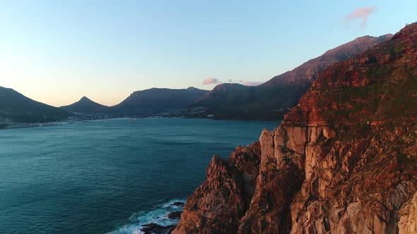 Beautiful Sunset View of Steep Cliffs That Run Into the Ocean