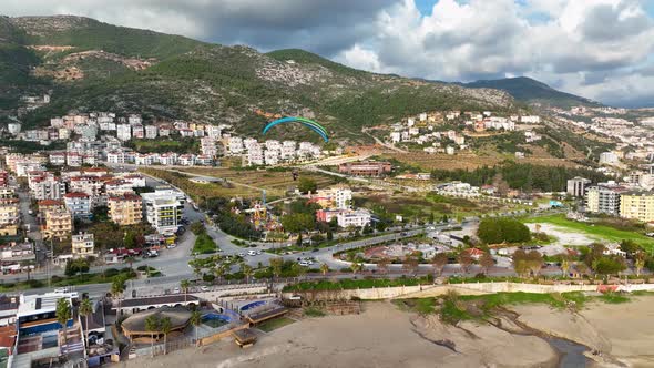 Aerial view of parachute jumper landing alt