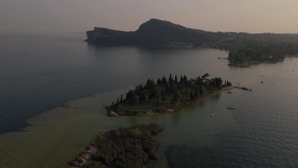 Aerial view on Rocca di Manerba, San Biagio small island on lake Garda, Italy alt
