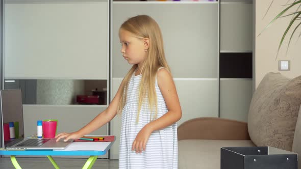 Child at home at the computer