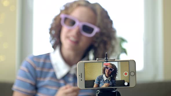 Teenager Social Media Vlogger Shooting Vlog Streaming Online Podcast on Mobile Phone alt