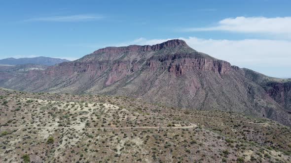 Drone shot of Arizona mountains and desert with cactus. alt