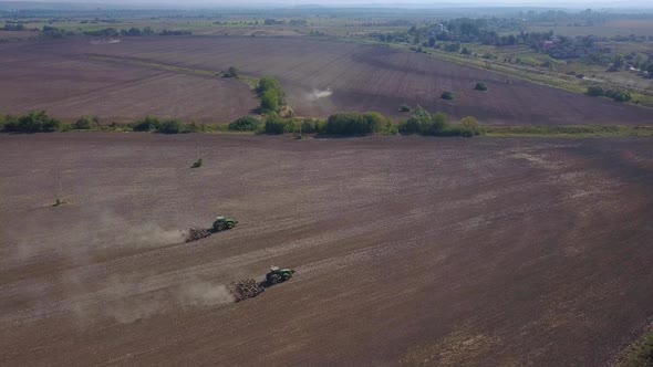 Drone Shooting of Tractors Cultivating Agricultural Land.