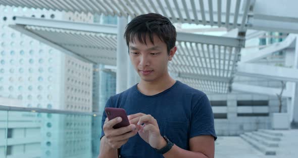 Man Use of Mobile Phone in City alt