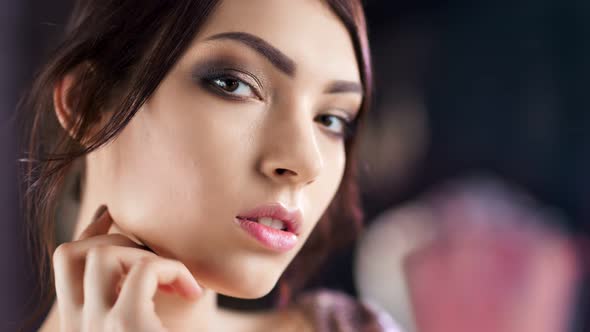 Closeup Face of Beautiful Hispanic Young Woman with Perfect Skin and Evening Makeup alt