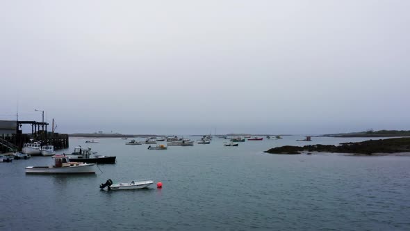 Zoom dolly Hitchcock effect over marina in Maine with fishing and lobster boats HD 30p alt