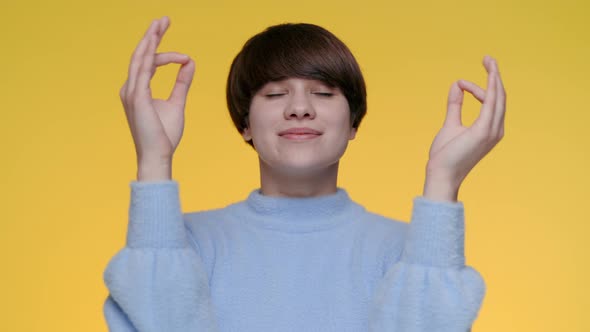 Attractive Woman Meditating with Closed Eyes at Studio alt
