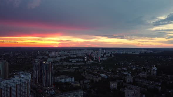 Epic aerial sunset in city residential district