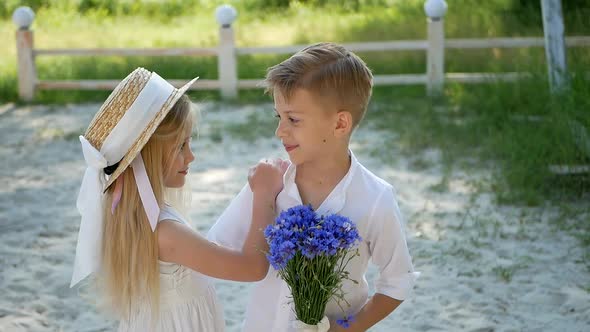 Brother and sister at the pond on a Sunny day, happy children alt