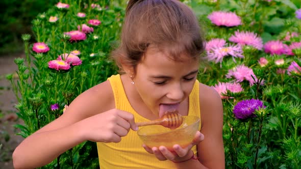 The Child Eats Honey in the Garden alt