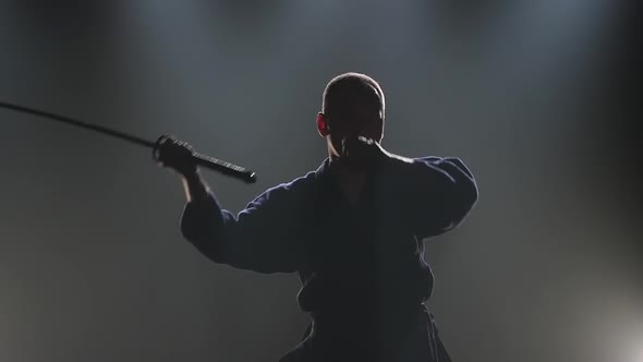Proficient Kendo Master Practicing Martial Art with the Katana Sword. Slow Motion alt