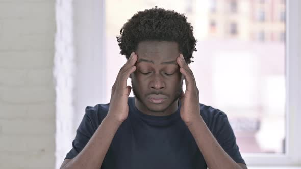 Portrait of Tired Young African American Man Having Headache alt