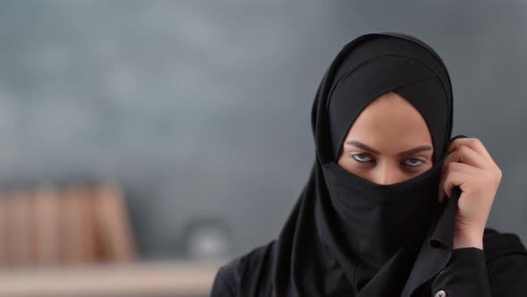 Portrait of Pretty Muslim Woman Covering Niqab Face Apart From Eyes alt