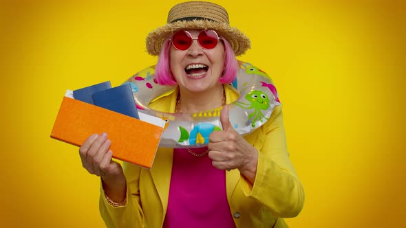 Traveler Tourist Senior Woman Holding Passport Tickets Dreams of Which Country to Go Rest Celebrate alt