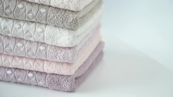 Stack of Cotton Terry Towels Rotate on Board