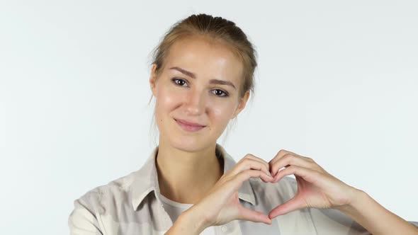 Young Girl Showing Heart Made by hands alt