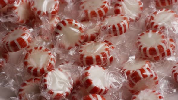 Rotating shot of peppermint candies - CANDY PEPPERMINT alt