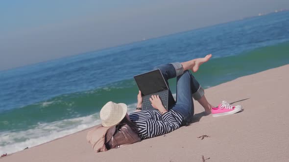 Woman Lying on Sand Beach Working Outside Vacation Time alt