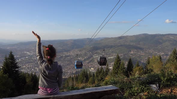 Little Girl Watching Cable Car alt