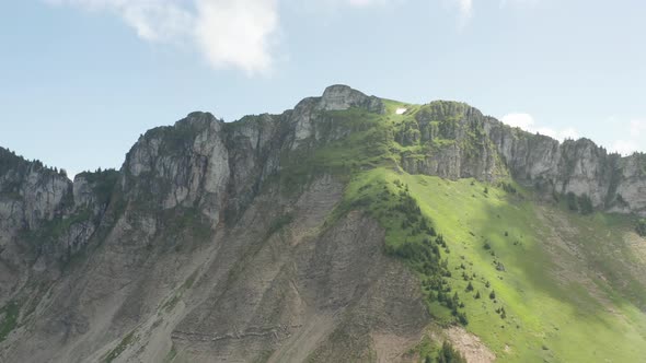 Flying towards beautiful rock formation in Switzerland alt