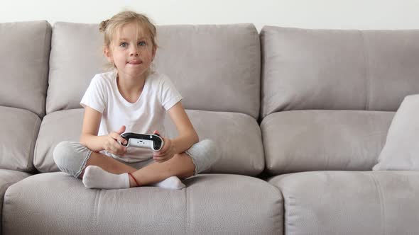 Girl Playing in Video Game Console Using Joystick Controller