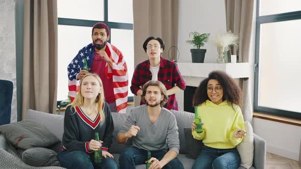 Interracial is a Fivemember Company Supporting Their Favorite Sports Team alt