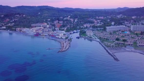 Greece, Corfu Island, drone footage of a beautiful sunset over Messonghi Beach. Orbit Shot. alt