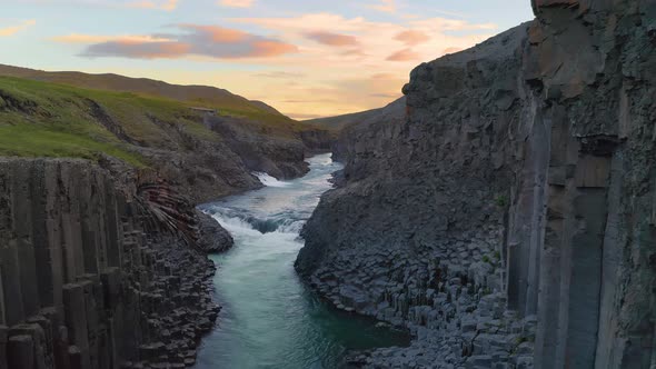 Flying Through the Studlagil Canyon in East Iceland at Sunset alt