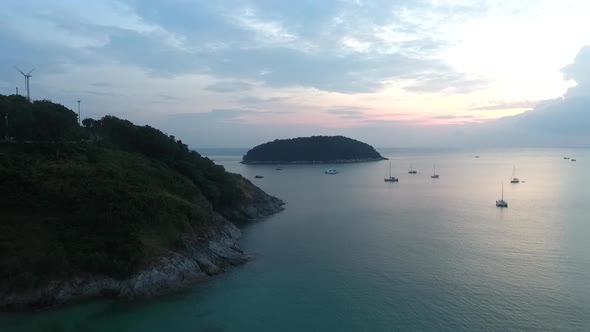 Aerial Shot of a Tropical Sailboat Bay At Sunset  alt