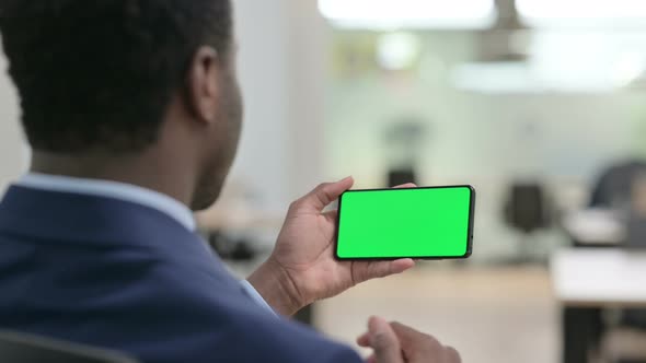 Businessman Watching Smartphone with Chroma Screen alt
