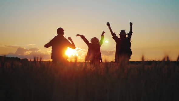 Silhouette Happy Family Farmers in a Wheat Field at Sunset., Stock Footage