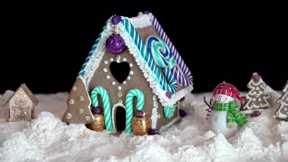 Christmas Holiday scene with Colourful gingerbread house on black background