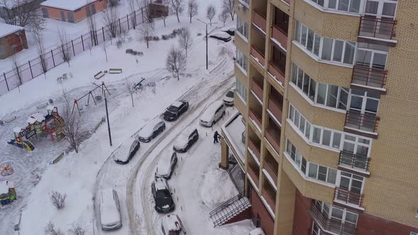 Modern Brick House and Snowcovered Yard After Snowfall