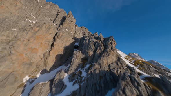 epic austrian winter mountain filmed by an fpv drone at sunrise alt
