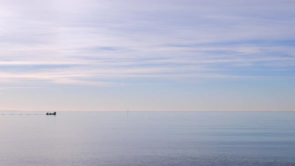 Beautiful calm sea water and small boat