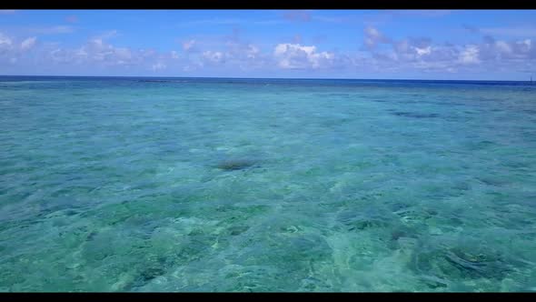 Aerial flying over nature of perfect shore beach trip by aqua blue ocean and white sand background o alt