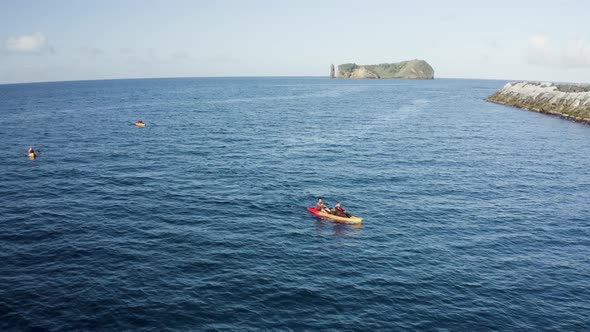 Aerial view of people doing kayak in Azores, Portugal. alt