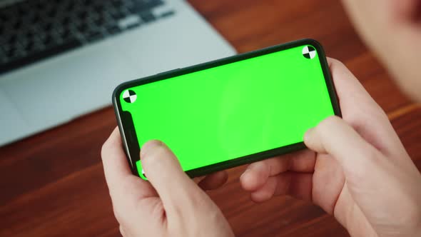 Man Using Smartphone with Chroma Key Closeup alt