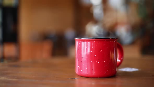 Steamy red metal mug