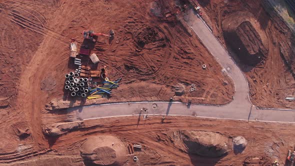 Over Head View Of Land Development Groud Works, Digger, Pipes, Road, Aerial View 4K