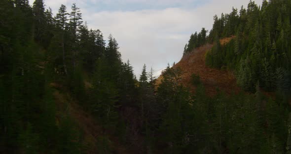 Aerial shot of Troopers helicopter flying over glacier, Alaskan mountains in background, drone