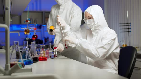 Biologist Examining Sample in Laboratory