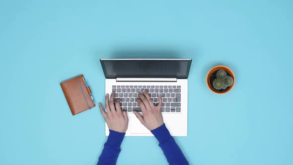 Minimalist desktop and woman working with a laptop