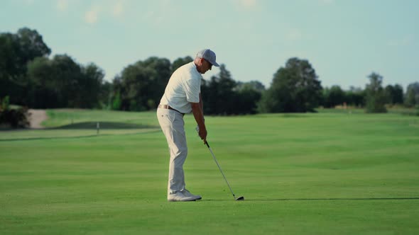 Old Man Play Golf on Grass Fairway alt